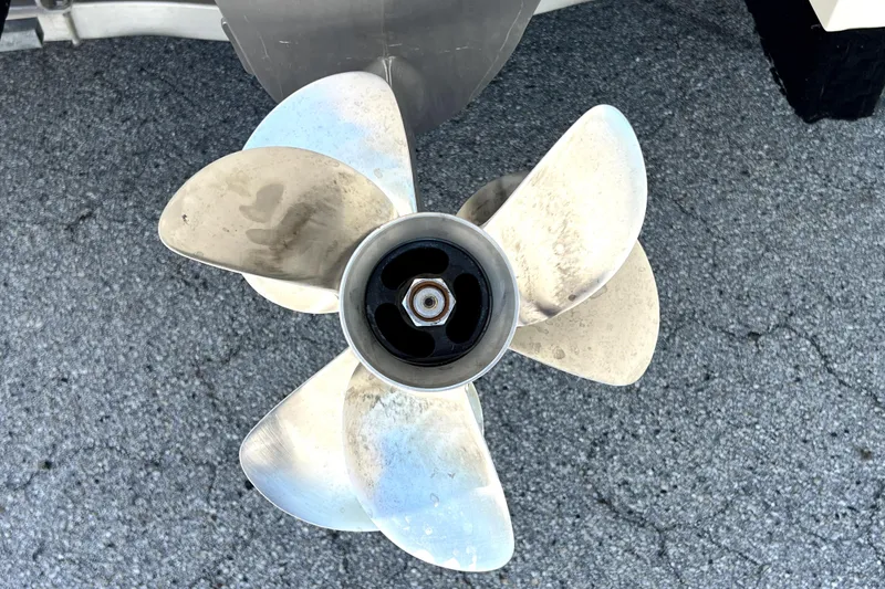 Slide: The Image of Propeller of 2013 Novurania Chase 23 boat on asphalt surface. - 9