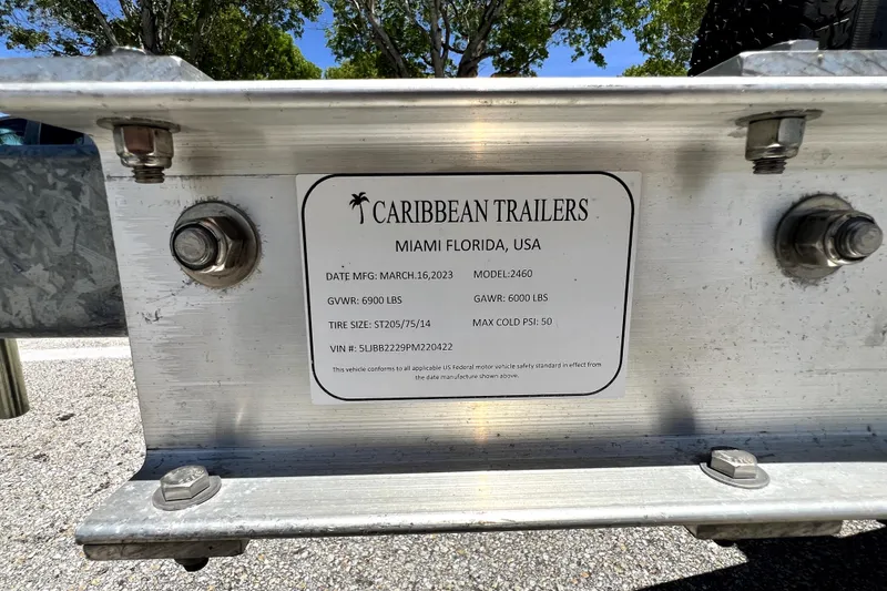 Slide: The Image of Caribbean Trailers label on Novurania Chase 23, 2013 model, displaying specifications and VIN. - 24