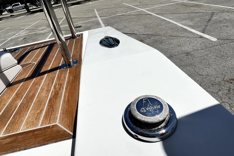 Slide: The Image of 2013 Novurania Chase 23 boat deck with wood finish and chrome fittings. - 84