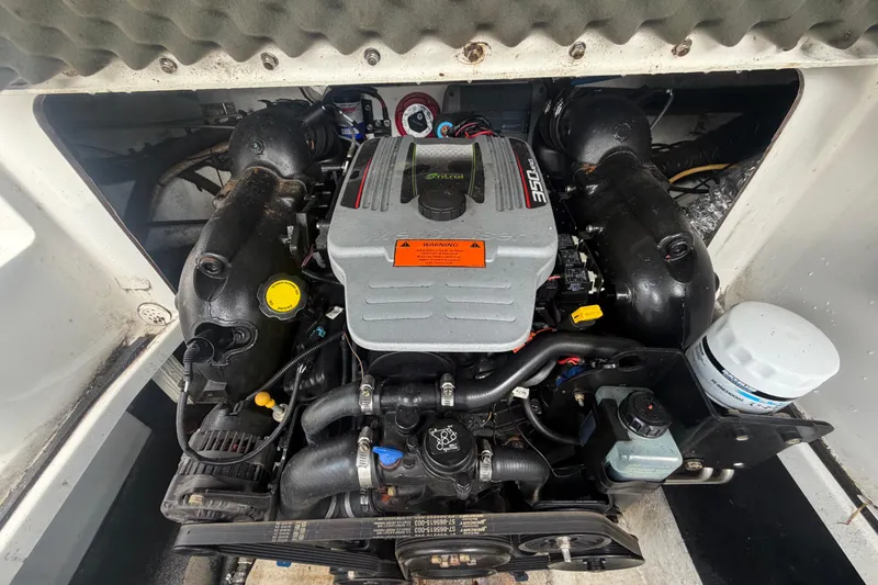 Slide: The Image of Engine compartment of a 2012 Crownline 236 SC boat, featuring a 350 MAG engine. - 89
