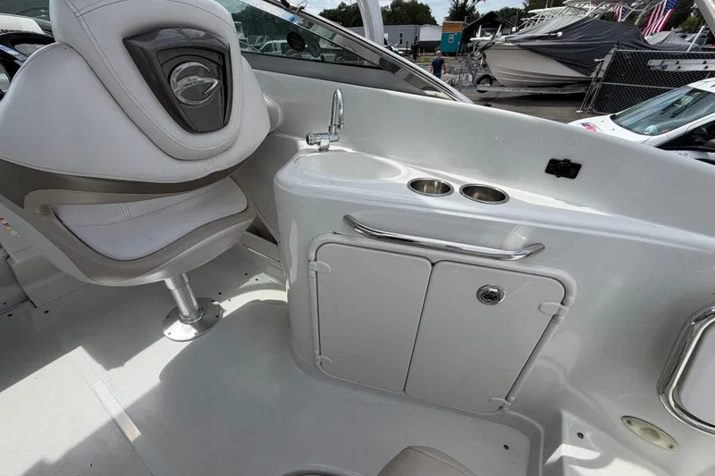 Slide: The Image of 2012 Crownline 236 SC boat interior with seating and sink area. - 25