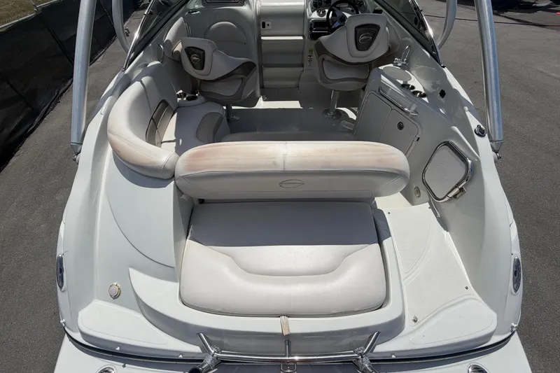 Slide: The Image of Interior of a 2012 Crownline 236 SC boat with seating and steering area. - 93
