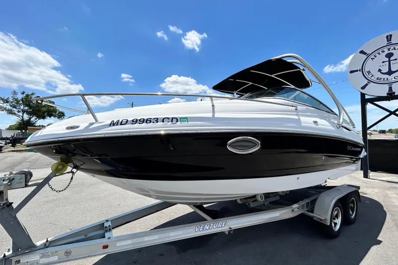 Slide: The Image of 2012 Crownline 236 SC boat on trailer under clear blue sky. - 9