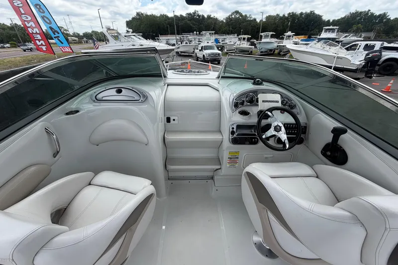 Slide: The Image of Interior view of a 2012 Crownline 236 SC boat with modern dashboard and seating. - 31