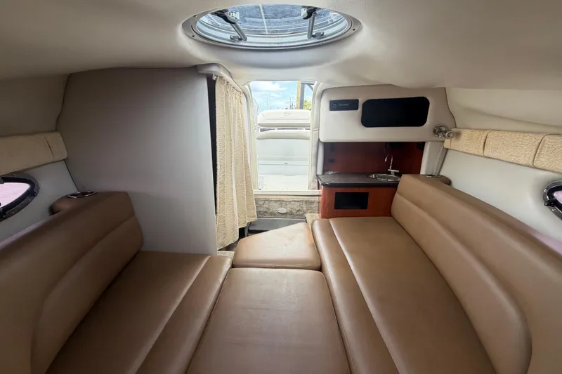 Slide: The Image of Interior cabin of 2012 Crownline 236 SC boat with seating and kitchenette. - 65