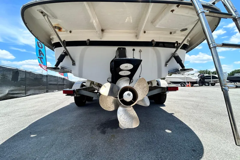 Slide: The Image of 2012 Crownline 236 SC boat stern view with propeller and trailer. - 5