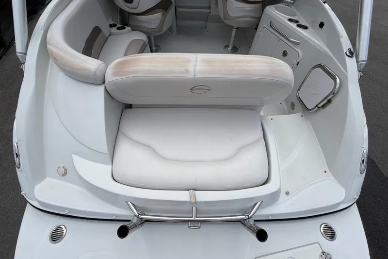 Slide: The Image of 2012 Crownline 236 SC boat interior with white seating and stainless steel accents. - 15