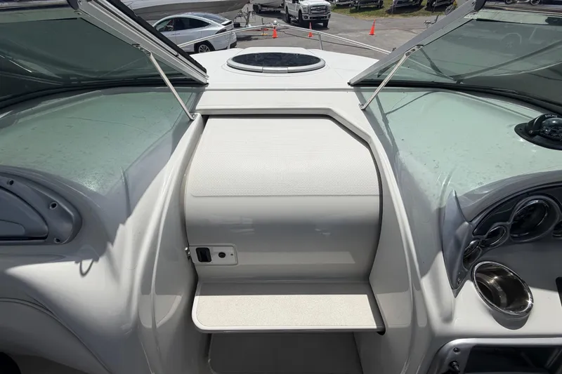 Slide: The Image of 2012 Crownline 236 SC boat interior with open windshield and dashboard view. - 71