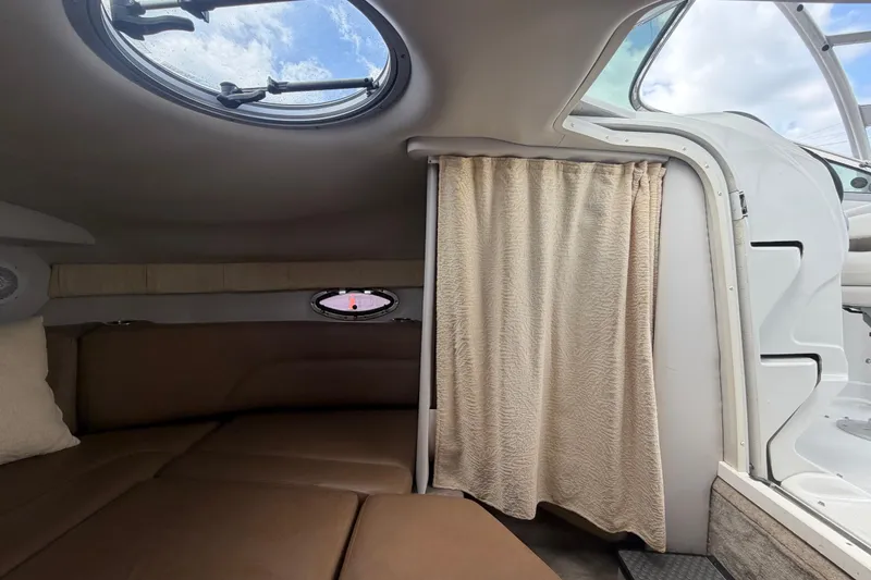 Slide: The Image of Interior cabin of 2012 Crownline 236 SC boat with seating and porthole. - 66