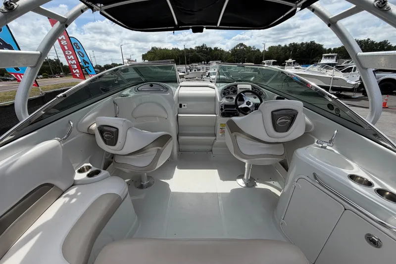 Slide: The Image of 2012 Crownline 236 SC boat interior with seating, steering wheel, and dashboard. - 24