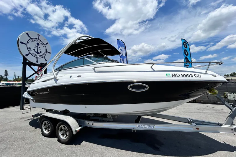 The Image of 2012 Crownline 236 SC boat on trailer under blue sky. - 0