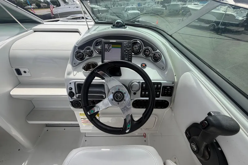 Slide: The Image of Steering console of a 2012 Crownline 236 SC boat with modern controls. - 35