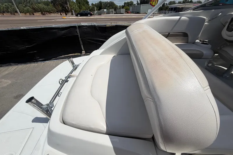 Slide: The Image of 2012 Crownline 236 SC boat interior with white leather seating and stainless steel fixtures. - 92
