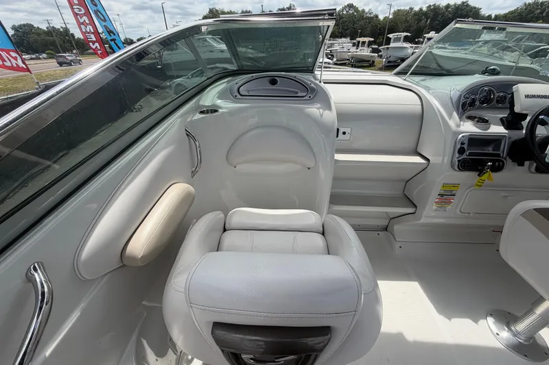 Slide: The Image of Interior of 2012 Crownline 236 SC boat with seating and dashboard view. - 47