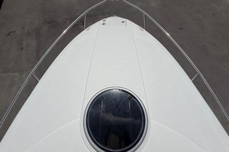 Slide: The Image of Bow view of 2012 Crownline 236 SC boat with circular hatch. - 73