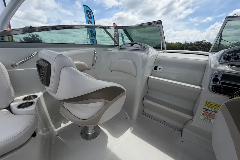 Slide: The Image of Interior of 2012 Crownline 236 SC boat with white seating and dashboard. - 46