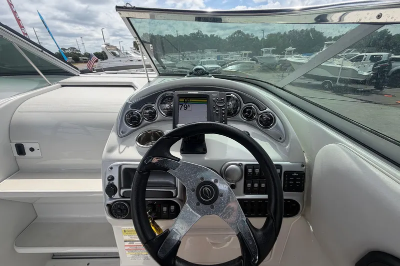 Slide: The Image of 2012 Crownline 236 SC boat dashboard with steering wheel and gauges. - 36