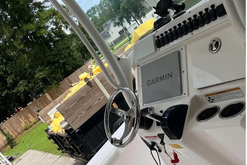 Slide: The Image of 2012 Everglades 243 Center Console boat dashboard with Garmin navigation system. - 3