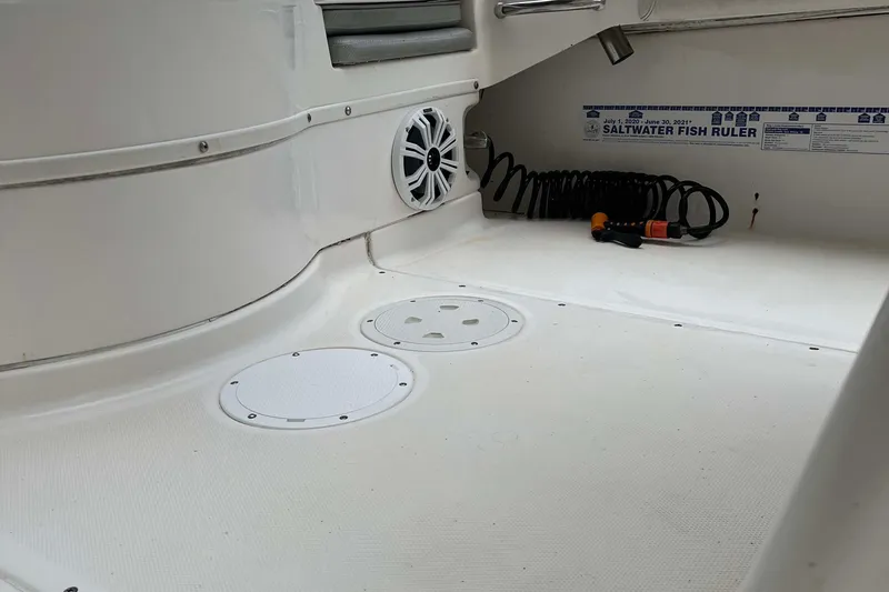 Slide: The Image of Interior of 2012 Everglades 243 Center Console boat with speaker and saltwater fish ruler. - 8