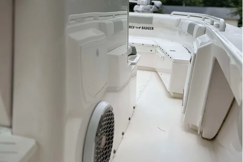 Slide: The Image of Interior view of a 2012 Everglades 243 Center Console boat, showcasing seating and storage. - 7