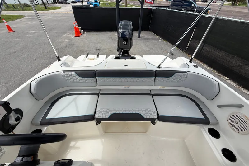 Slide: The Image of 2024 Bayliner Element M17 boat interior with seating and steering wheel. - 40