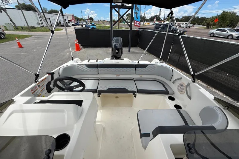 Slide: The Image of 2024 Bayliner Element M17 boat interior with seating and steering wheel. - 39
