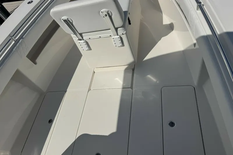 Slide: The Image of 2013 Invincible 36 Open Fisherman boat interior with seating and storage compartments. - 21