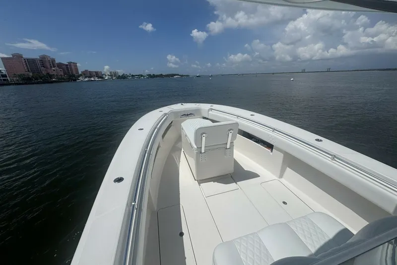 Slide: The Image of 2013 Invincible 36 Open Fisherman boat on calm waters under a clear sky. - 7