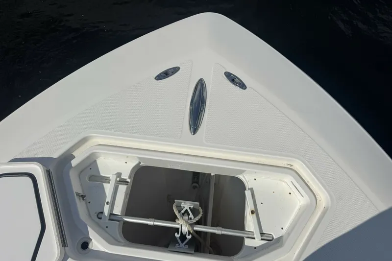 Slide: The Image of Bow of 2013 Invincible 36 Open Fisherman with anchor storage compartment. - 20