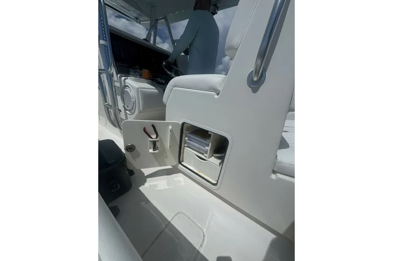 Slide: The Image of 2013 Invincible 36 Open Fisherman boat interior with open storage compartment. - 5