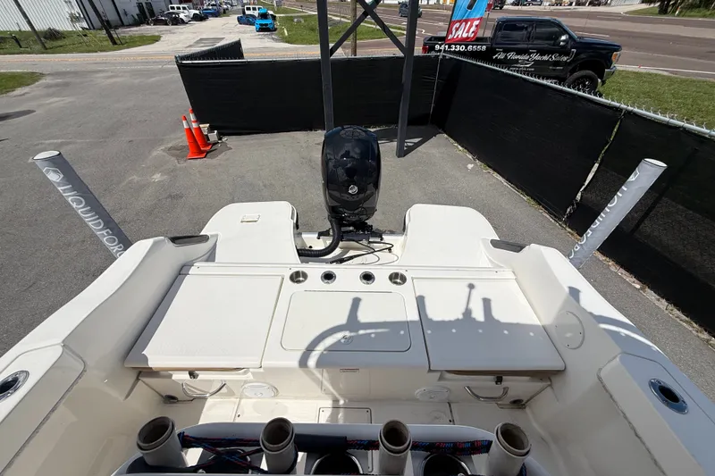 Slide: The Image of 2024 Bayliner Trophy T22CC boat with outboard motor, displayed outdoors for sale. - 57