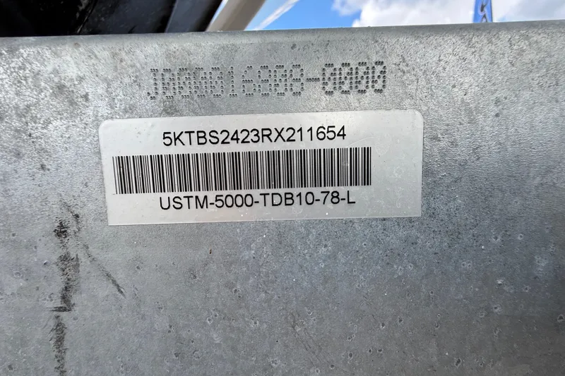 Slide: The Image of Barcode and serial number on 2024 Bayliner Trophy T22CC boat component. - 69