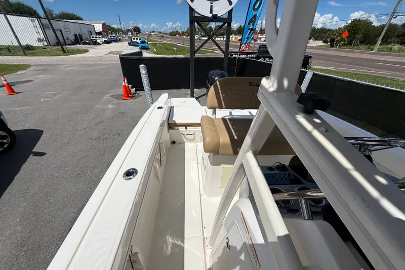 Slide: The Image of 2024 Bayliner Trophy T22CC boat interior with beige seating and white deck. - 53