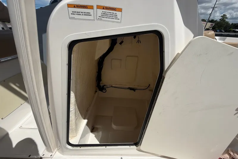Slide: The Image of Open storage compartment on 2024 Bayliner Trophy T22CC boat, showcasing interior space. - 50