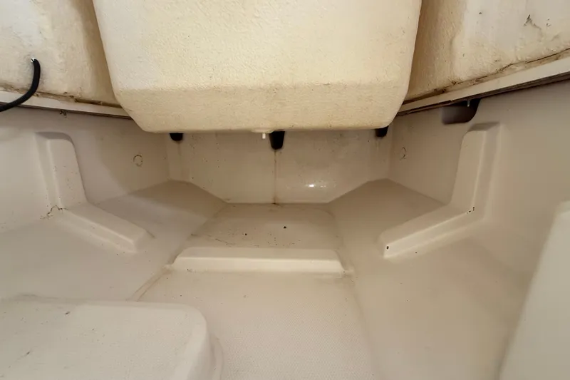 Slide: The Image of 2024 Bayliner Trophy T22CC interior storage compartment, showcasing spacious and clean design. - 52