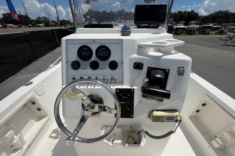 Slide: The Image of 2005 Sea Fox 197 Center Console boat dashboard with steering wheel and controls. - 15