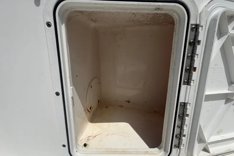Slide: The Image of Open storage compartment on a 2005 Sea Fox 197 Center Console boat. - 47