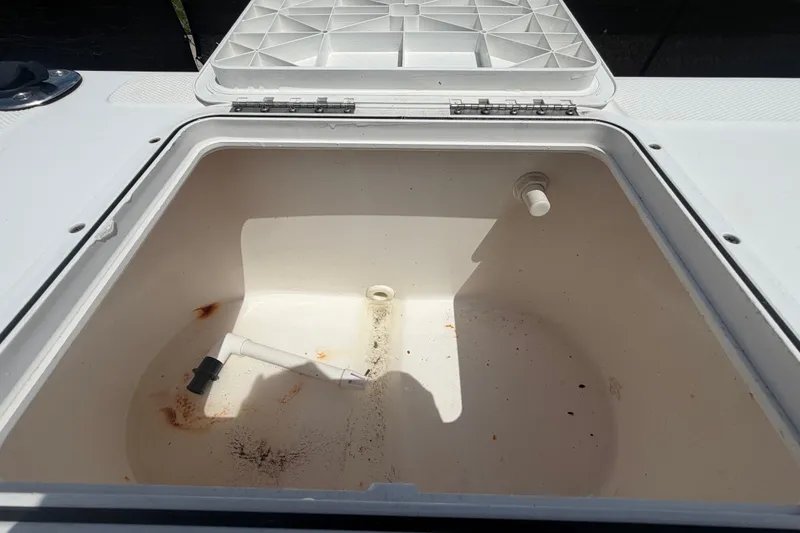 Slide: The Image of Open storage compartment on a 2005 Sea Fox 197 Center Console boat. - 49