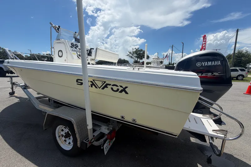 Slide: The Image of 2005 Sea Fox 197 Center Console boat on trailer with Yamaha outboard motor. - 5