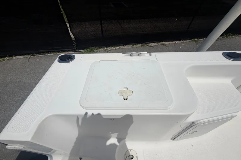 Slide: The Image of 2005 Sea Fox 197 Center Console boat deck with storage compartment. - 48