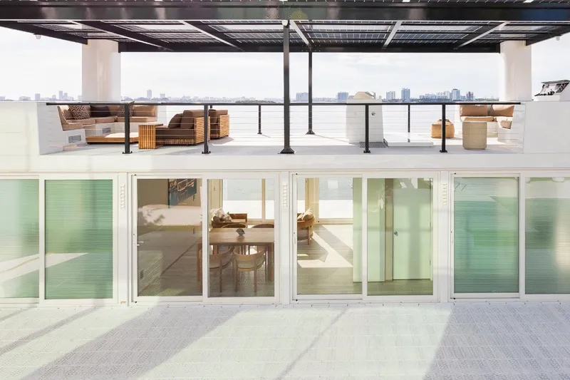 Slide: The Image of Modern Arkhaus Villa 50 (2025) with rooftop lounge and panoramic city views. - 13