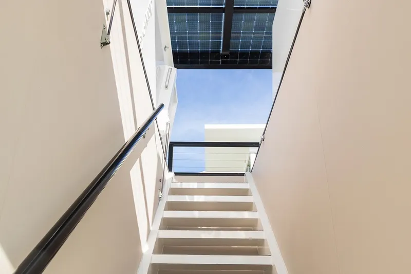 Slide: The Image of Modern staircase in Arkhaus Villa 50, 2025 model, with glass railing and skylight. - 14