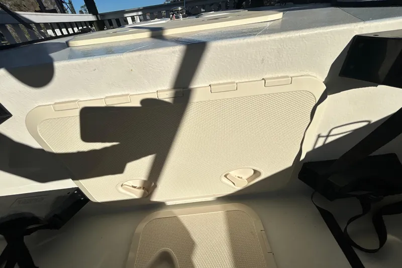 Slide: The Image of 2024 Custom Florida Flats CC boat hatch with shadows and textured surface. - 21