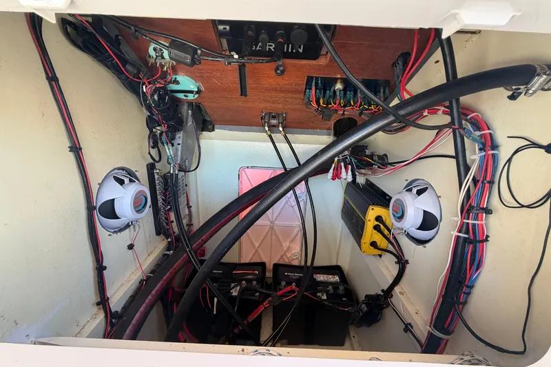 Slide: The Image of 2024 Custom Florida Flats CC boat wiring and electronics setup with speakers and batteries. - 27
