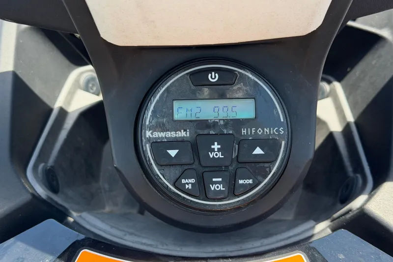 Slide: The Image of 2024 Kawasaki Jetski STX 160LX dashboard with Hifonics audio controls. - 18