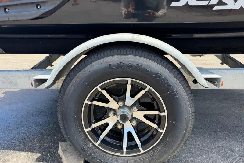 Slide: The Image of Trailer wheel for 2024 Kawasaki Jetski STX 160LX, featuring Load Star tire. - 48
