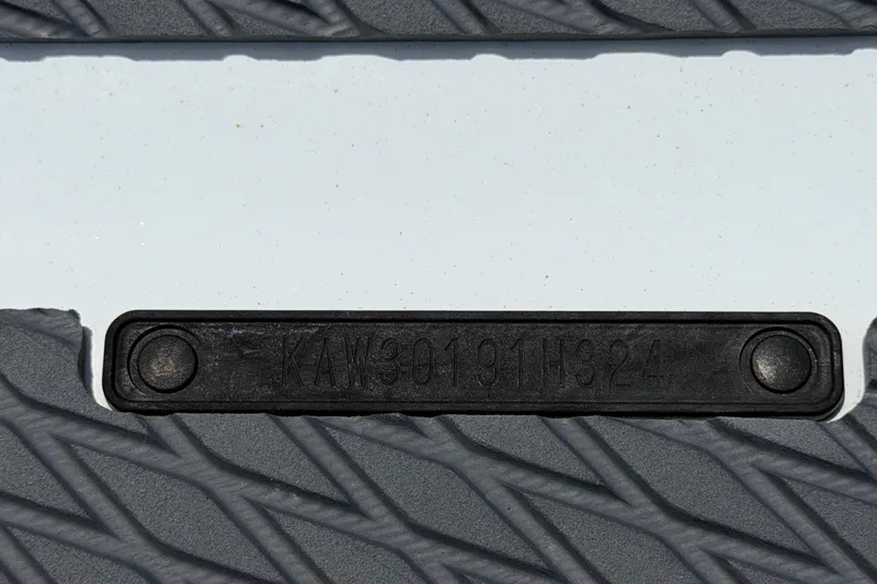 Slide: The Image of Close-up of 2024 Kawasaki Jetski STX 160LX textured footrest and identification plate. - 46