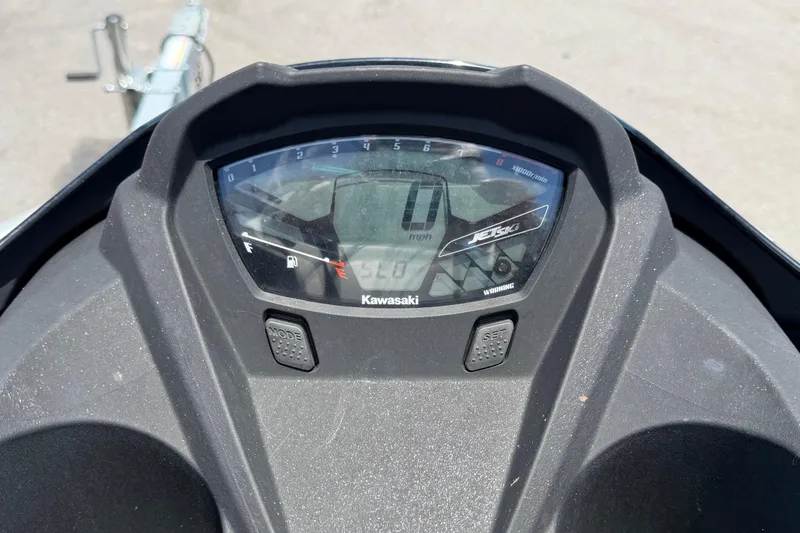 Slide: The Image of Dashboard of 2024 Kawasaki Jetski STX 160LX showing speedometer and controls. - 38