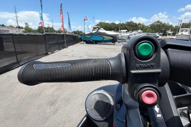 Slide: The Image of Close-up of 2024 Kawasaki Jetski STX 160LX handlebar with start and stop buttons. - 17