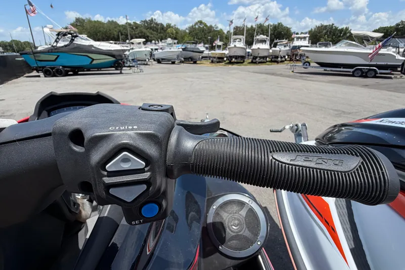 Slide: The Image of Close-up of 2024 Kawasaki Jetski STX 160LX handlebar with cruise control buttons. - 19
